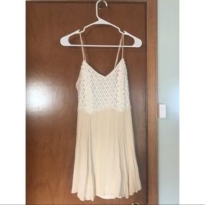 Cream dress with lace.